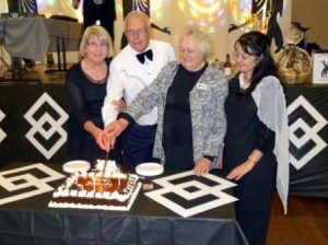 Cutting the birthday cake with Josie who received her 10 year life membership