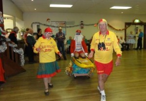 Surfin Santa and the two lifesavers - Eddie and Rosalie